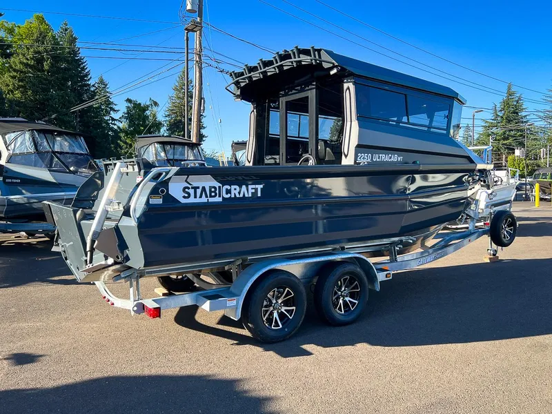 Slide: The Image of 2023 Stabicraft 2250 UltraCab WT boat on a trailer in a parking lot. - 3