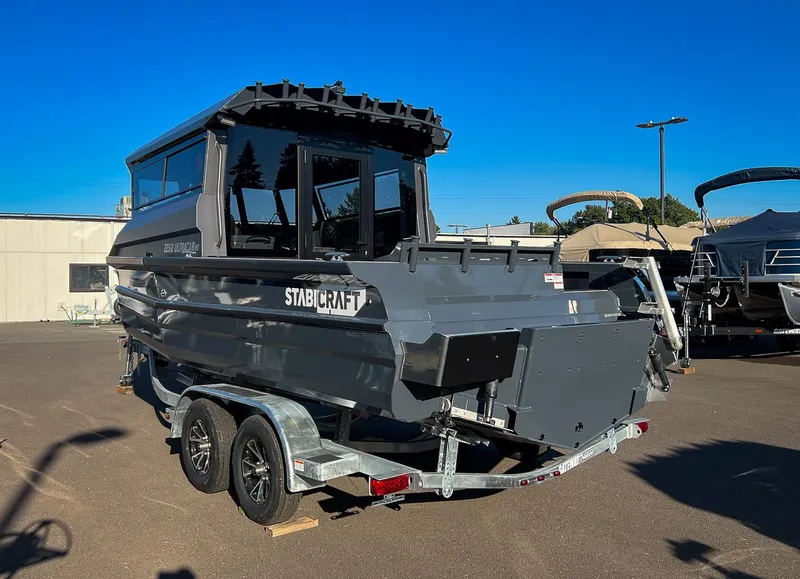 Slide: The Image of 2023 Stabicraft 2250 UltraCab WT boat on a trailer in a parking lot. - 5