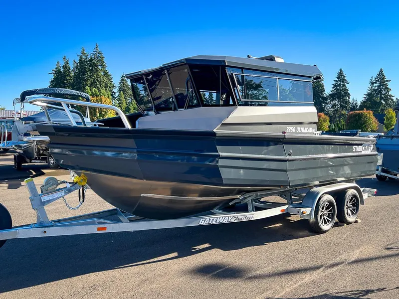 Slide: The Image of 2023 Stabicraft 2250 UltraCab WT boat on trailer in outdoor setting. - 6