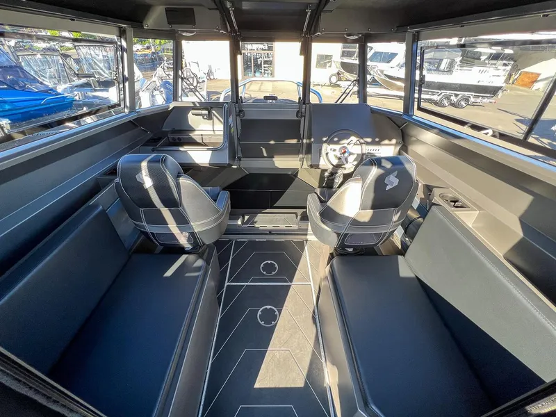 Slide: The Image of 2023 Stabicraft 2250 UltraCab WT interior with seating and steering wheel. - 7