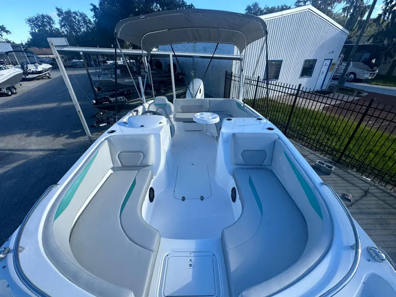 Slide: The Image of 2024 Hurricane SunDeck Sport 188 OB boat with spacious seating and canopy. - 4