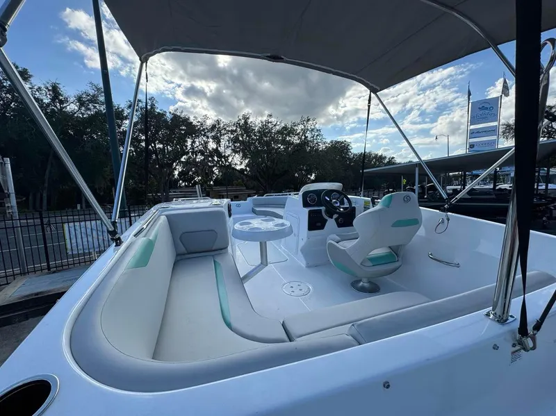 Slide: The Image of 2024 Hurricane SunDeck Sport 188 OB boat interior with seating and steering console. - 7