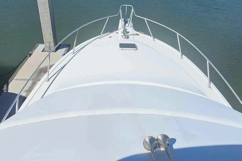 Slide: The Image of Bow view of a 1998 Ocean Yachts 40 Super Sport docked. - 14