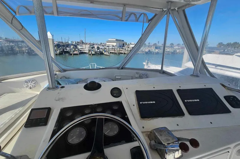 Slide: The Image of Helm of 1998 Ocean Yachts 40 Super Sport with marina view. - 15