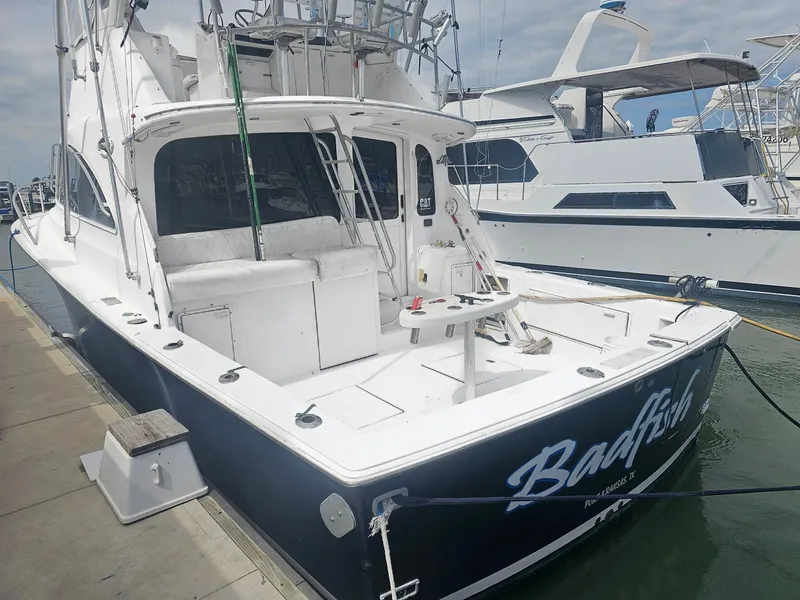 Slide: The Image of 1998 Ocean Yachts 40 Super Sport docked at marina. - 3