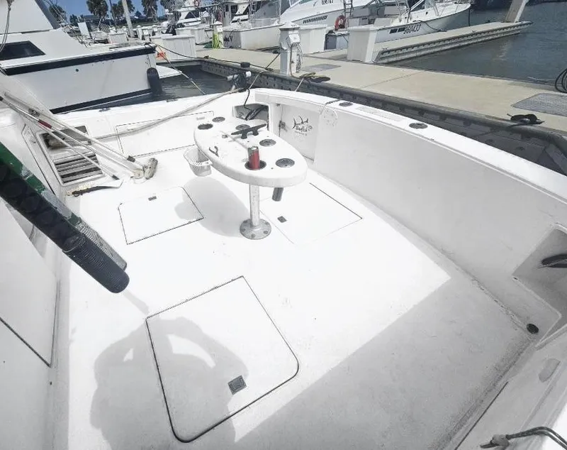 Slide: The Image of 1998 Ocean Yachts 40 Super Sport fishing deck at marina. - 6