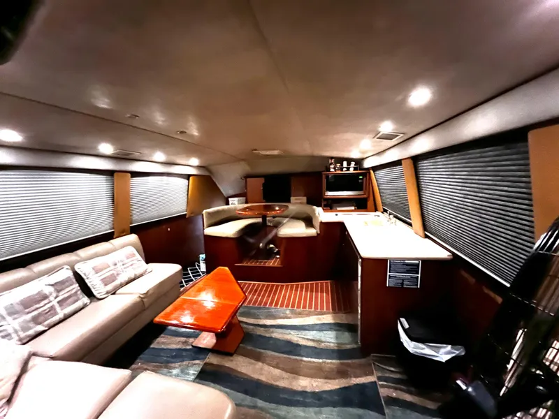 Slide: The Image of Interior of 1998 Ocean Yachts 40 Super Sport with modern furnishings and ample seating. - 7