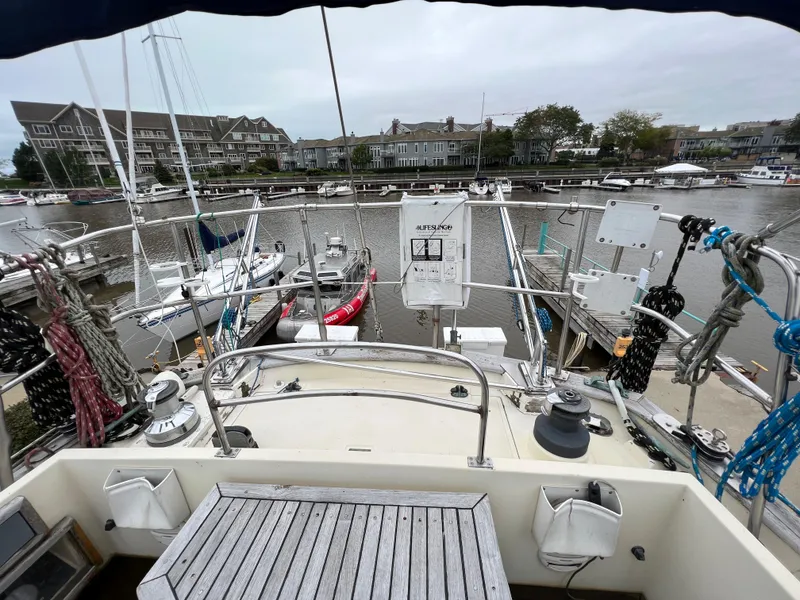 Slide: The Image of Krogen 38 (1986) yacht docked at a marina with other boats. - 12