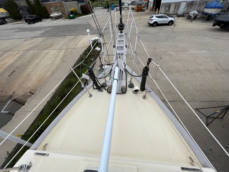 Slide: The Image of 1986 Krogen 38 sailboat bow view in a marina. - 17