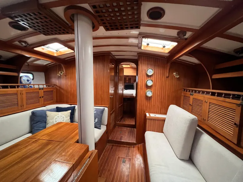 Slide: The Image of Interior of 1986 Krogen 38 yacht with wooden finishes and cozy seating. - 30