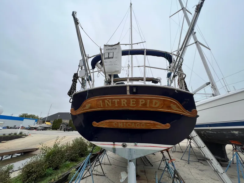 Slide: The Image of 1986 Krogen 38 sailboat Intrepid docked in a marina, rear view. - 4