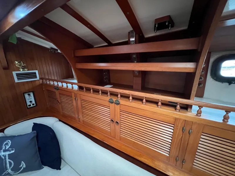 Slide: The Image of Interior of 1986 Krogen 38 yacht with wooden cabinetry and seating area. - 40