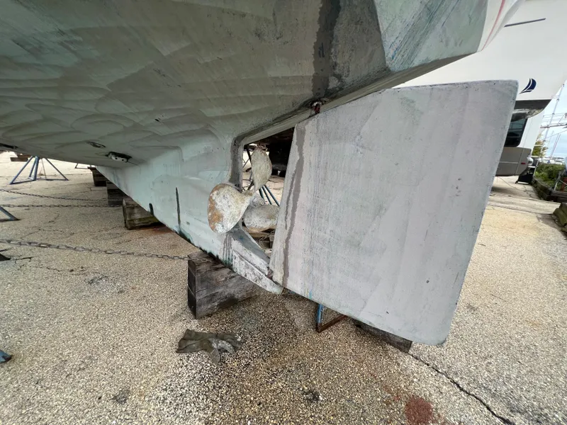 Slide: The Image of 1986 Krogen 38 boat propeller and rudder on dry dock. - 49