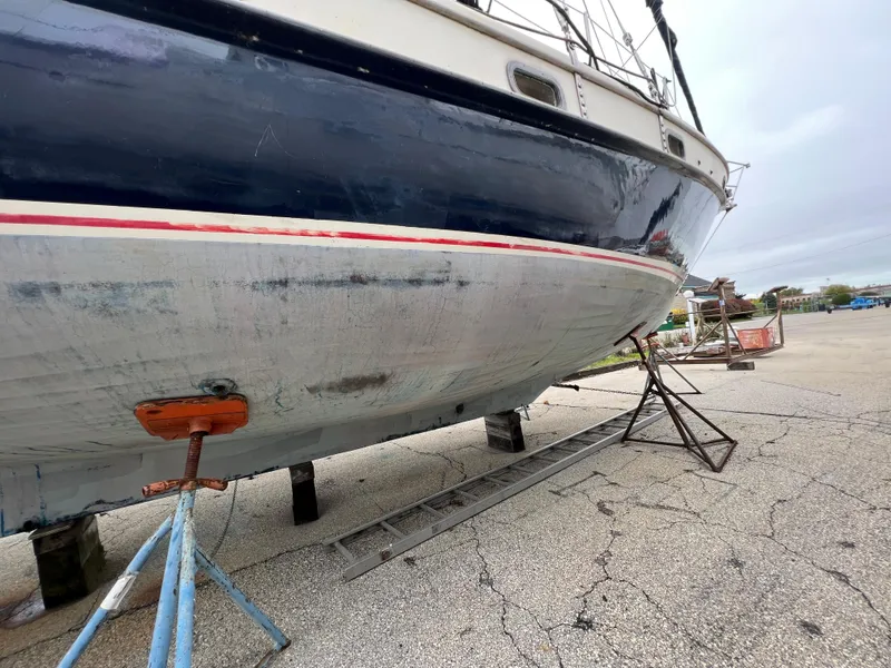Slide: The Image of 1986 Krogen 38 sailboat on dry dock for maintenance. - 7