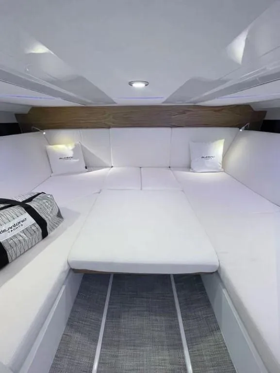 Slide: The Image of Luxurious interior of 2024 De Antonio Yachts D36 OPEN with plush white seating. - 10