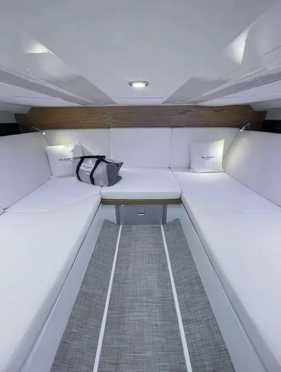 Slide: The Image of Interior of 2024 De Antonio Yachts D36 OPEN, featuring sleek white seating and modern design. - 11