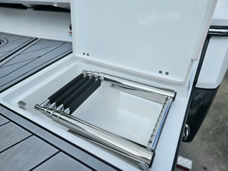 Slide: The Image of 2024 Monterey 215SS boat with integrated swim ladder. - 11