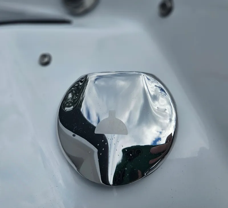 Slide: The Image of Close-up of a 2024 Monterey 215SS boat's chrome fuel cap. - 12