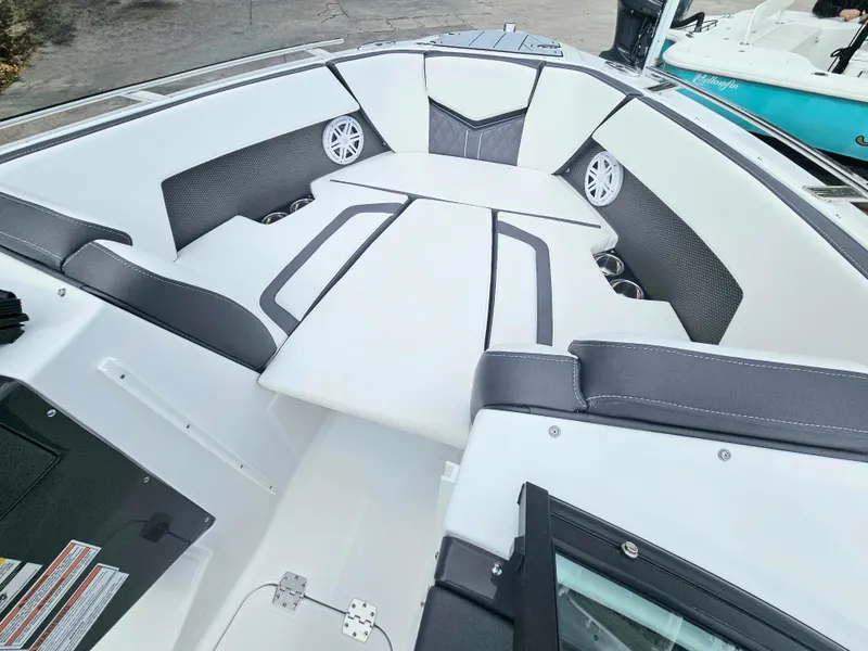 Slide: The Image of 2024 Monterey 215SS boat interior with white and black seating. - 13