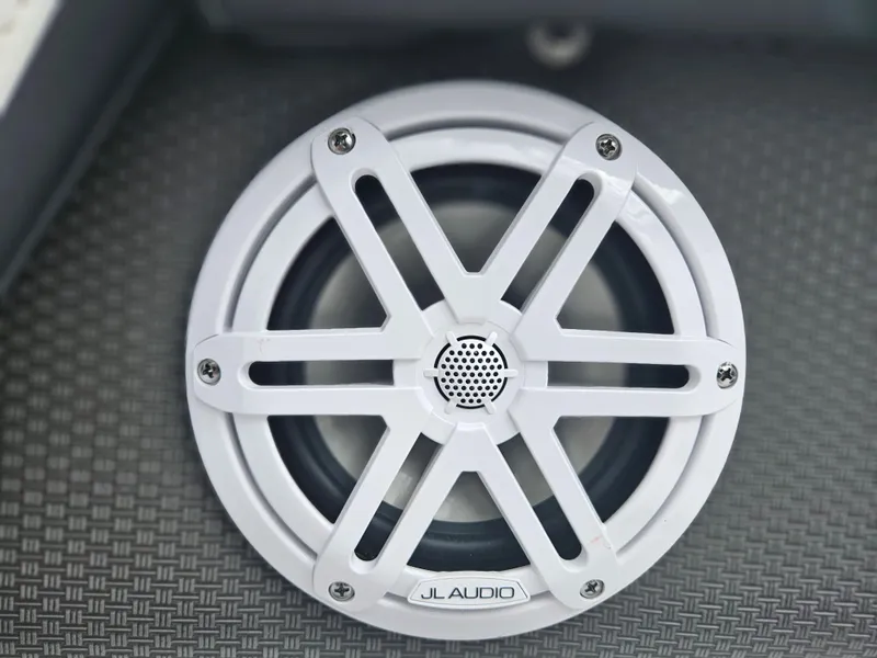 Slide: The Image of White JL Audio speaker on a 2024 Monterey 215SS boat. - 16