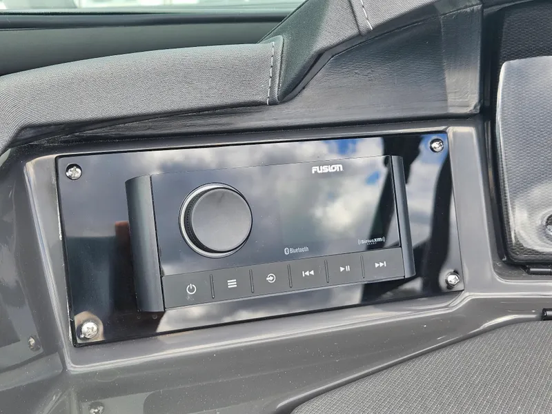 Slide: The Image of 2024 Monterey 215SS boat dashboard with Fusion Bluetooth stereo system. - 24