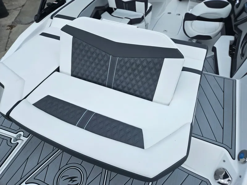 Slide: The Image of 2024 Monterey 215SS boat with stylish, diamond-stitched seating and modern interior design. - 29