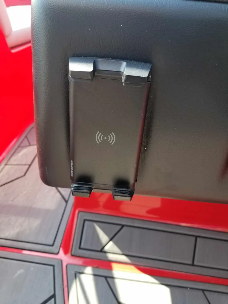 Slide: The Image of Wireless phone charger on 2024 ATX Surf Boats 22 Type-S, featuring sleek black design. - 14