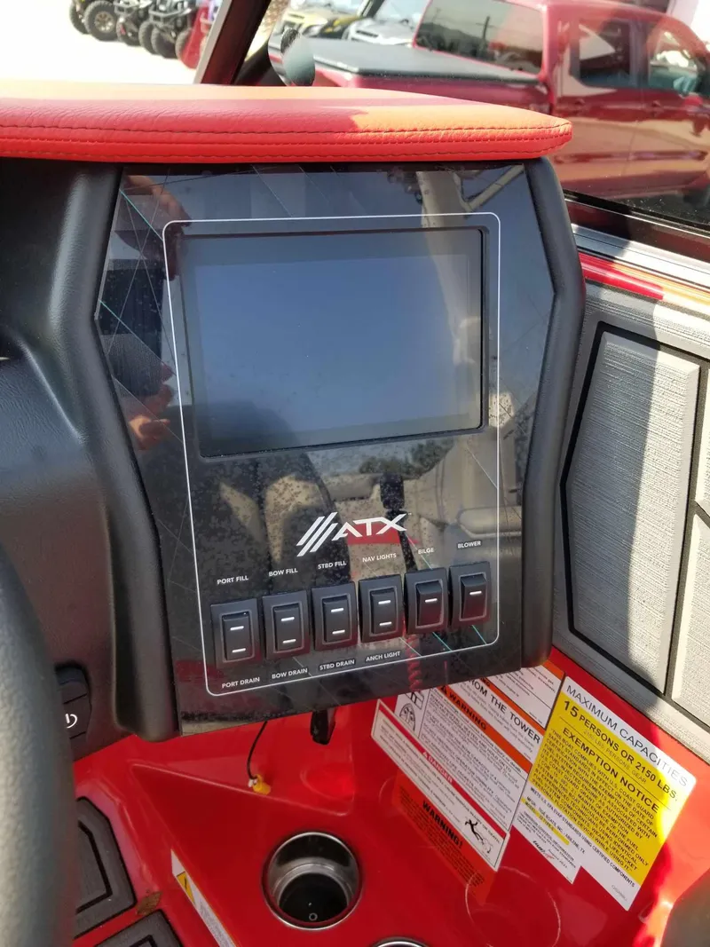 Slide: The Image of 2024 ATX Surf Boats 22 Type-S dashboard with touchscreen and control buttons. - 17