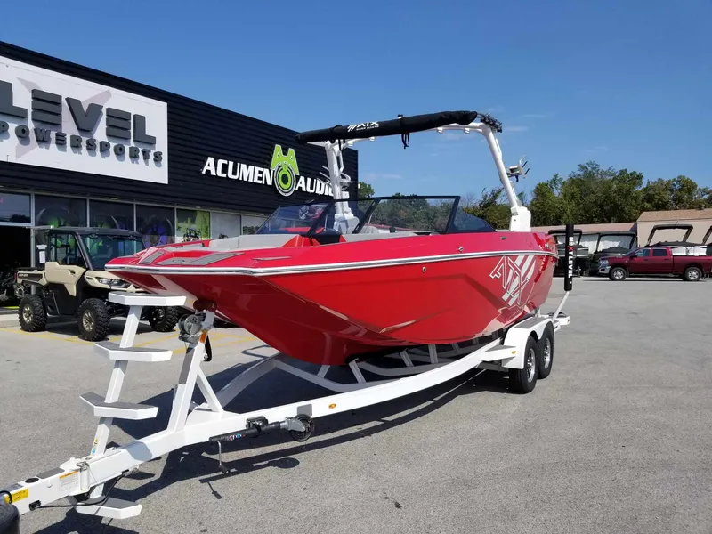 Slide: The Image of 2024 ATX Surf Boats 22 Type-S in red on trailer, parked outside dealership. - 2