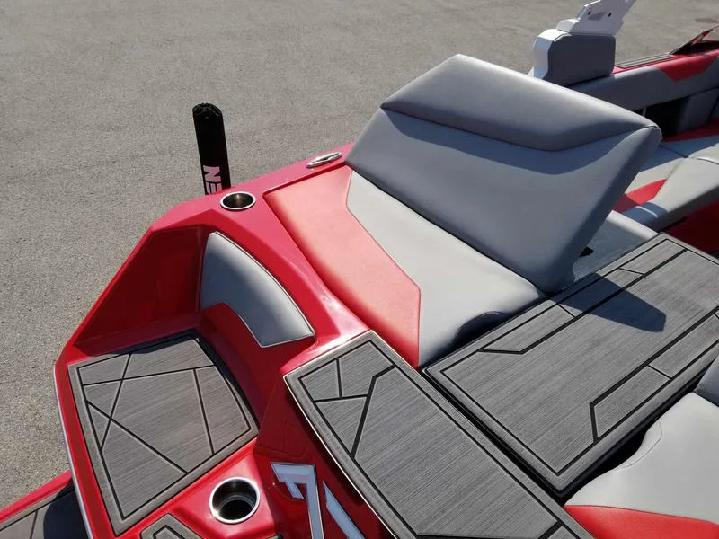 Slide: The Image of 2024 ATX Surf Boats 22 Type-S interior with red and gray seating and cup holders. - 20