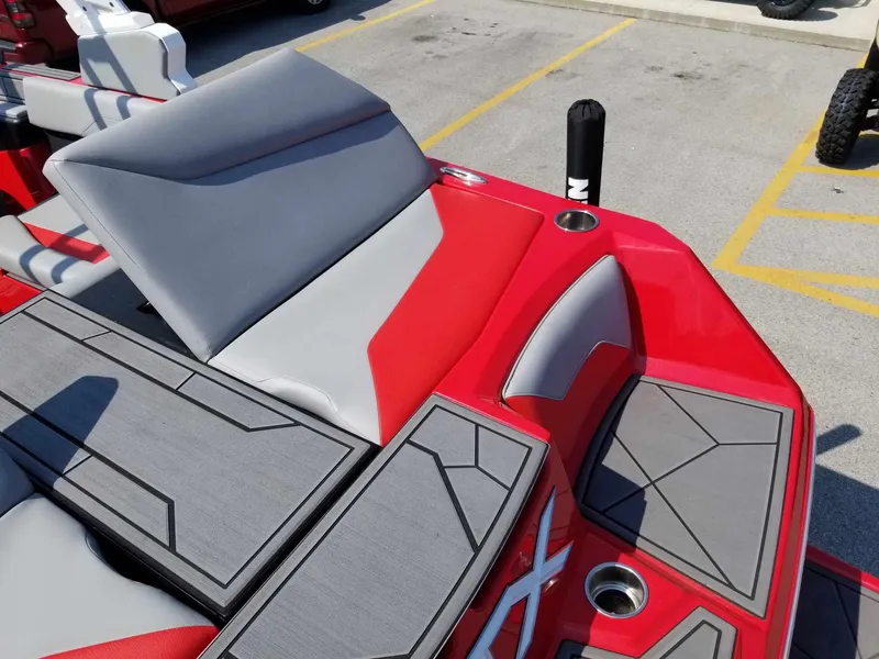 Slide: The Image of 2024 ATX Surf Boats 22 Type-S interior with red and gray seating and deck design. - 21