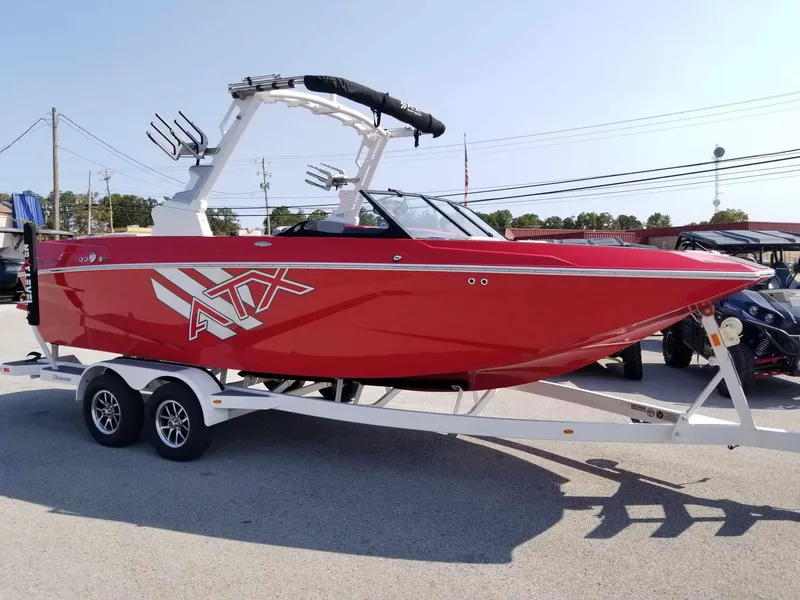 Slide: The Image of 2024 ATX Surf Boats 22 Type-S in vibrant red on a trailer. - 4