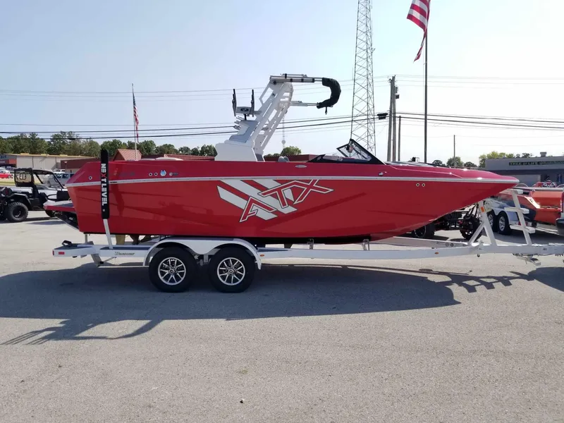 Slide: The Image of 2024 ATX Surf Boats 22 Type-S, red, on trailer, parked outdoors. - 5