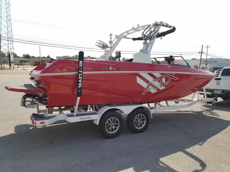 Slide: The Image of 2024 ATX Surf Boats 22 Type-S, red, on trailer, parked outdoors. - 6