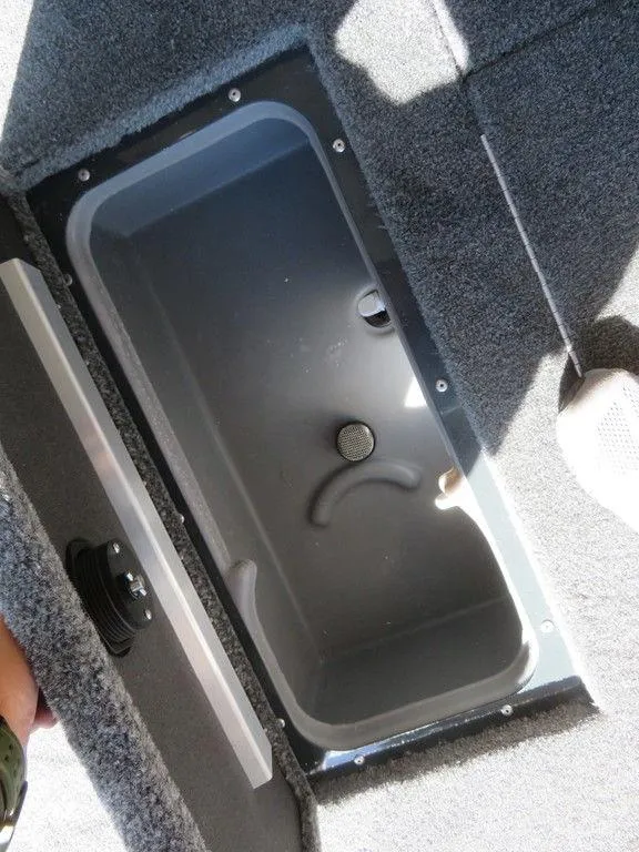 Slide: The Image of 2023 Ranger RT178C boat storage compartment with open lid. - 10