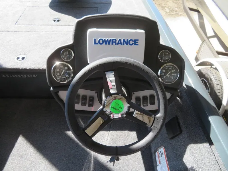 Slide: The Image of 2023 Ranger RT178C boat dashboard with Lowrance electronics and steering wheel. - 4