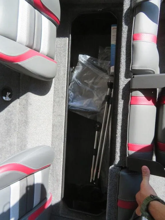 Slide: The Image of 2023 Ranger RT178C boat storage compartment with fishing gear. - 7