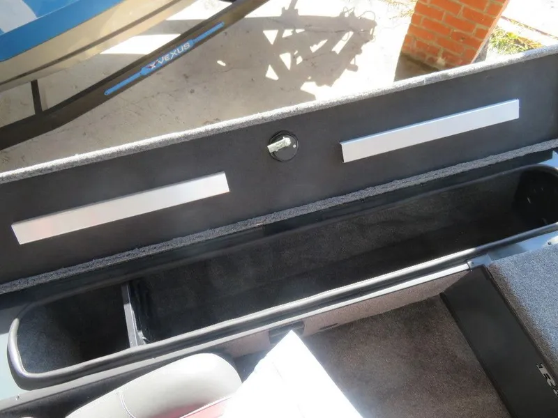 Slide: The Image of 2023 Ranger RT178C boat storage compartment with open lid. - 9