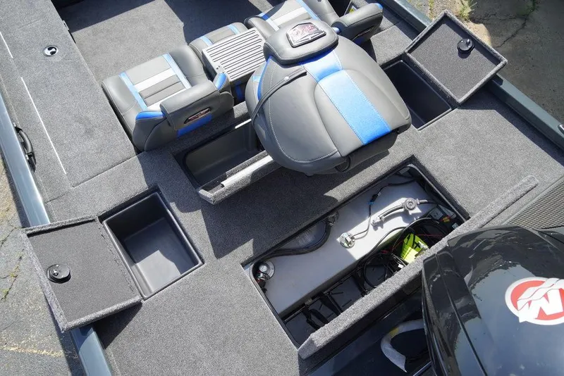Slide: The Image of 2024 Ranger RT188C boat interior with storage compartments and seating. - 3
