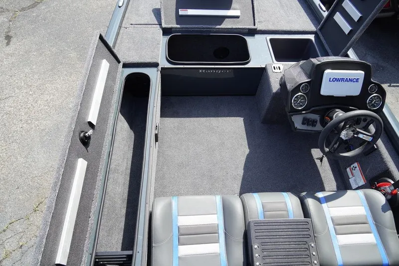 Slide: The Image of 2024 Ranger RT188C boat interior with Lowrance electronics and ample storage compartments. - 4