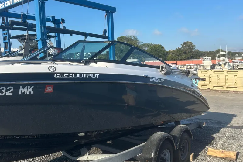 Slide: The Image of 2013 Yamaha Boats 212SS on trailer at marina, high output model. - 12