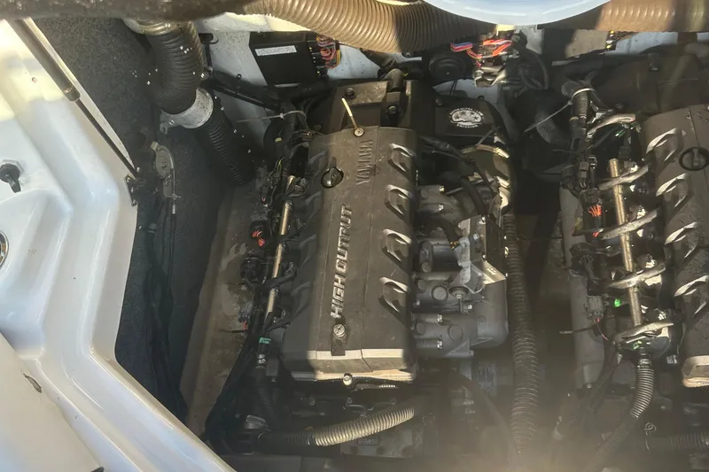 Slide: The Image of Engine compartment of a 2013 Yamaha Boats 212SS, showcasing high-output engines. - 20