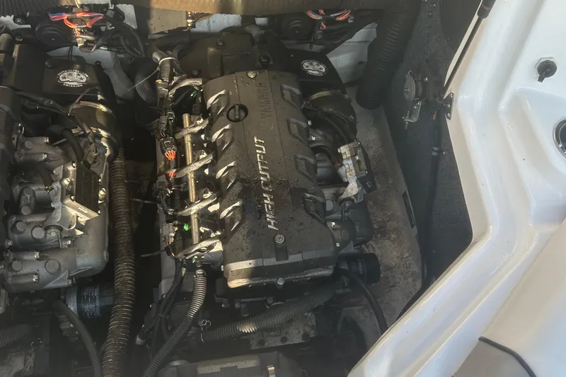 Slide: The Image of Engine compartment of a 2013 Yamaha Boats 212SS, featuring high output engines. - 21