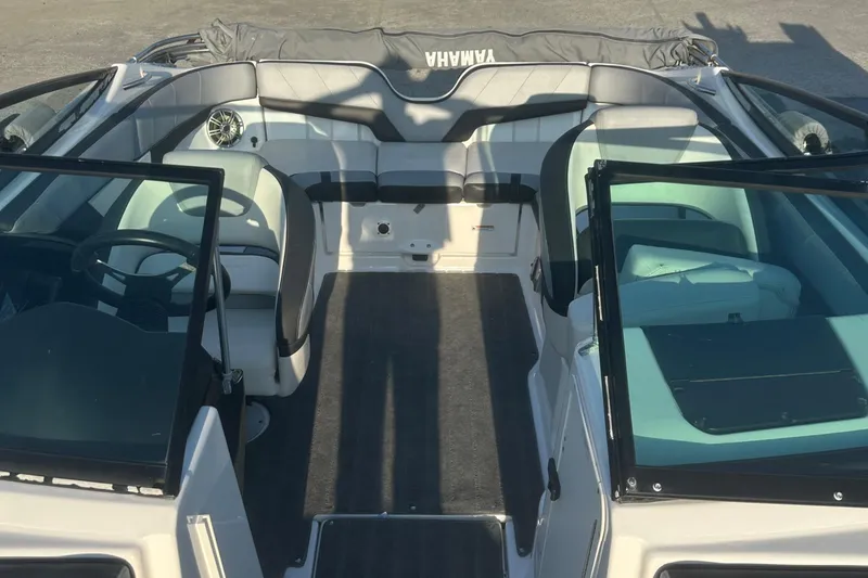 Slide: The Image of 2013 Yamaha Boats 212SS interior with seating and steering wheel, showcasing spacious design. - 22