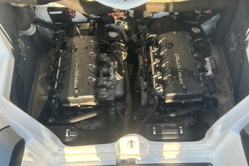 Slide: The Image of 2013 Yamaha Boats 212SS engine compartment with dual high-output engines. - 23