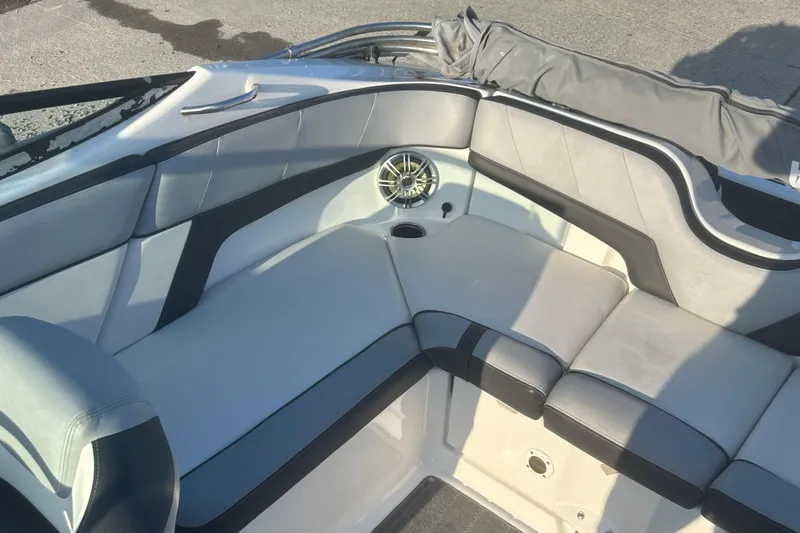 Slide: The Image of 2013 Yamaha Boats 212SS interior with cushioned seating and speaker detail. - 28