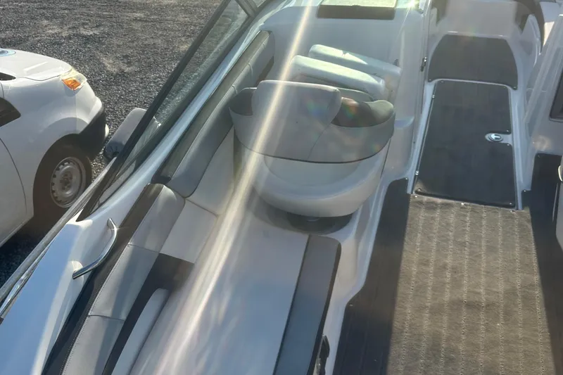 Slide: The Image of 2013 Yamaha Boats 212SS interior with seating and sunlit deck. - 36