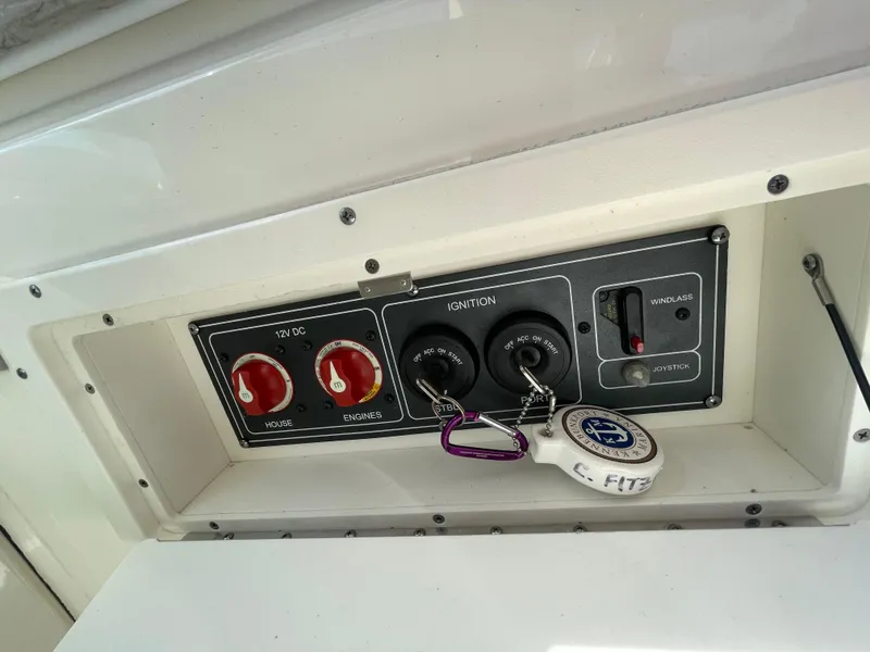 Slide: The Image of Control panel of a 2016 Boston Whaler 320 Vantage boat with ignition keys. - 23