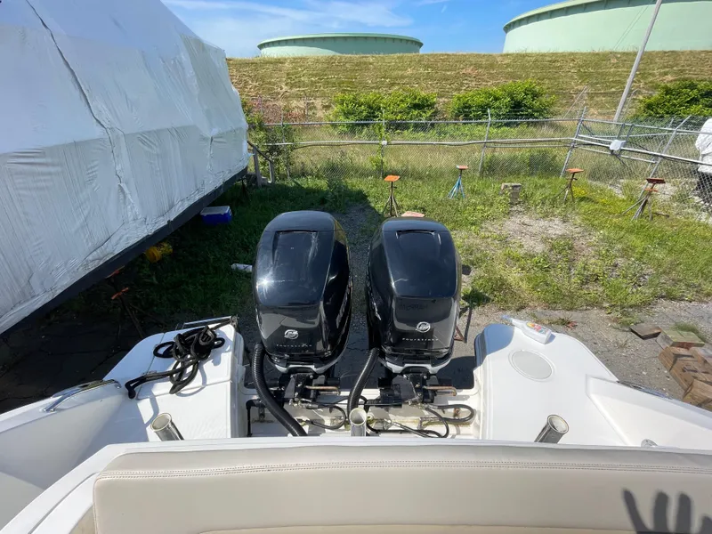Slide: The Image of 2016 Boston Whaler 320 Vantage with twin outboard engines in storage yard. - 6