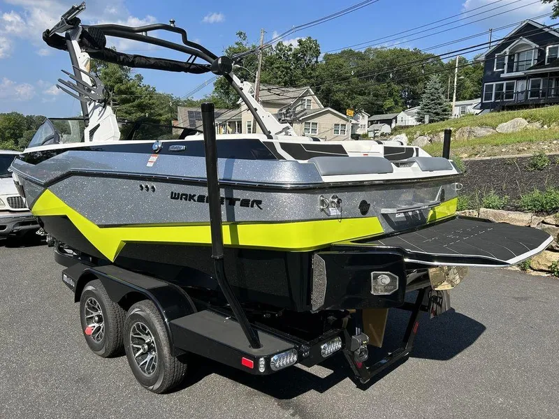 Slide: The Image of 2024 Malibu 22 LSV Wakesetter boat on a trailer, rear view. - 6
